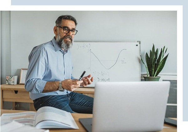 a teacher doing a online class in front of the camera