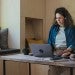 Working student catching up on online master's courses while traveling