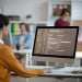 Woman learning computer science and programming online at work