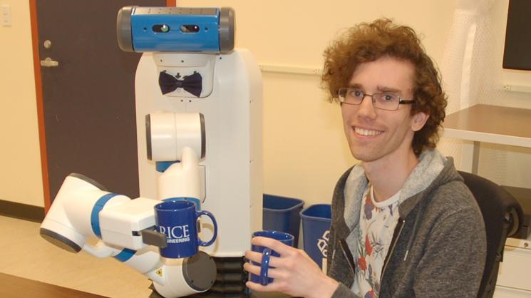 Robot and Zak Kingston holding coffee cups
