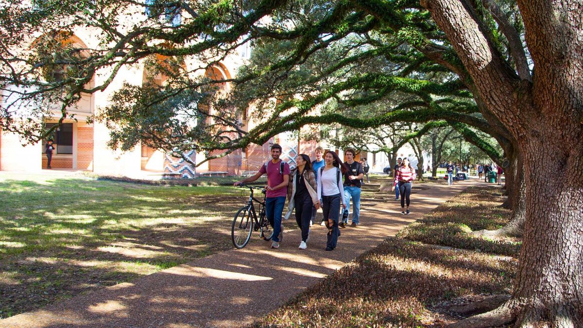 Rice CS grad students walking outside of Duncan Hall