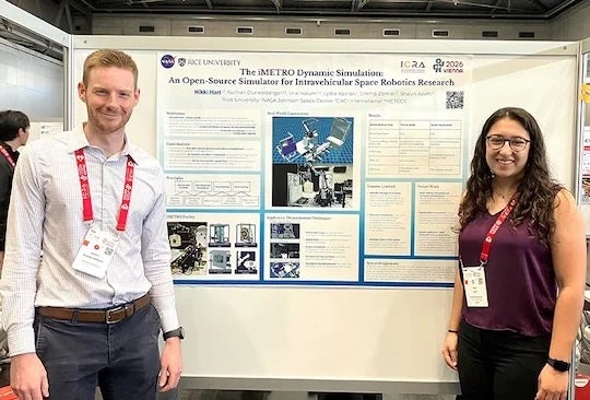 NASA's&nbsp;Nathan Dunkelberger and Rice's&nbsp;Nikki Hart stand beside the team's project poster at&nbsp;the platform at the 2026 IEEE International Conference on Robotics and Automation in Vienna. (Photo courtesy of Shaun Azimi)
