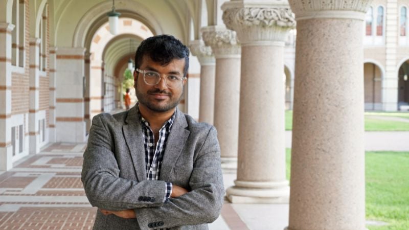 Rahul Shome standing outside on the Rice University campus