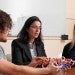 Lydia Kavraki sitting with two graduate students